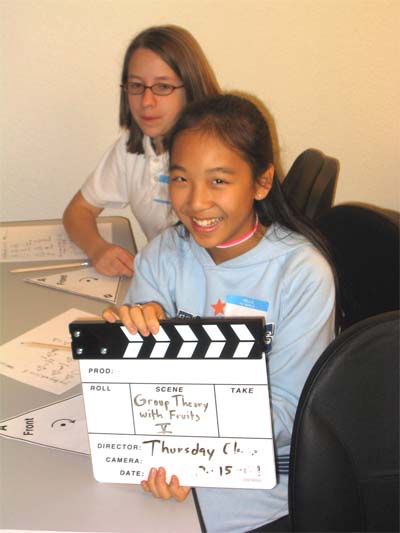Student with studio clapper