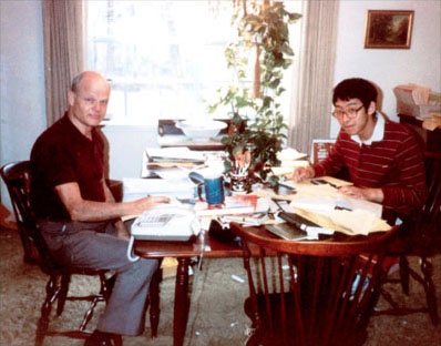 Frank Wang at the famous dining-room table with John Saxon